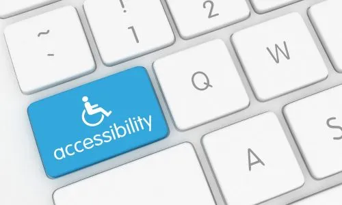 Inscription «Accessibilité» avec le logo handicap sur un clavier.